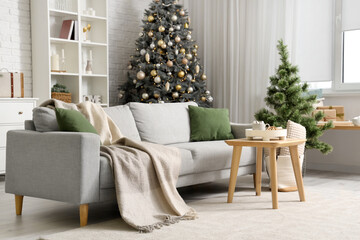 Obraz premium Stylish interior of modern living room with beautiful Christmas trees