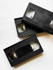 Retro vhs tapes on white background reflecting vintage technology