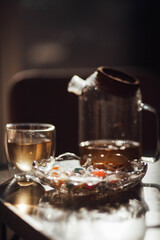 A kettle of herbal tea is on the table. 