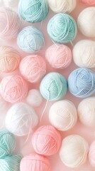 A pastel-colored background featuring balls of yarn in various shades, arranged neatly to create an abstract pattern that evokes the feeling of knitting and crocheting