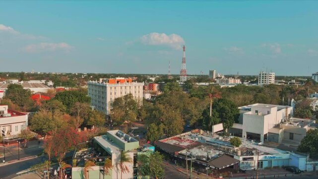 This captivating aerial footage presents a comprehensive view of Merida, Mexico, a city brimming with life and energy. The video opens with a sweeping panoramic shot that sets the stage for the visual