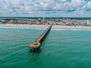 Beach and Surf City ocean Pier  in the Outer Banks,  Surf City, North Carolina, United States.