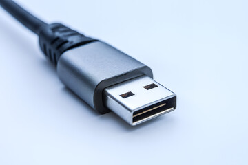 Close-up of a USB-C connector, showcasing its sleek design and metallic finish.