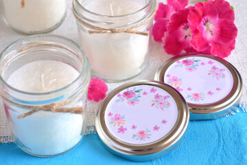 Wedding favor jar candle white color jute ribbon pink color flower homemade souvenir for party event celebration, spring summer season blue color background, gift making, home decoration