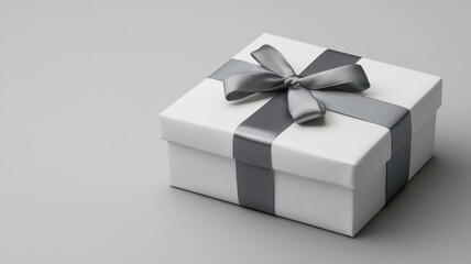 Elegant luxury gift box adorned with a satin ribbon, featuring a blank space for personalized text on the side.