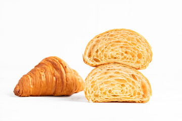 Cut in Half Croissant with Inside Texture and Thin Crisp Layers. Delicious French Pastry. Light background.