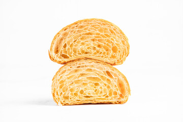 Cut in Half Croissant with Inside Texture and Thin Crisp Layers. Delicious French Pastry. Light background.