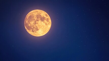 Naklejka premium A full, bright moon with a yellow glow hangs in a dark blue night sky with scattered stars.