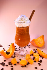 pumpkin latte with whipped cream. hot spicy drink for warm autumn evenings. healthy nutritious drink.
