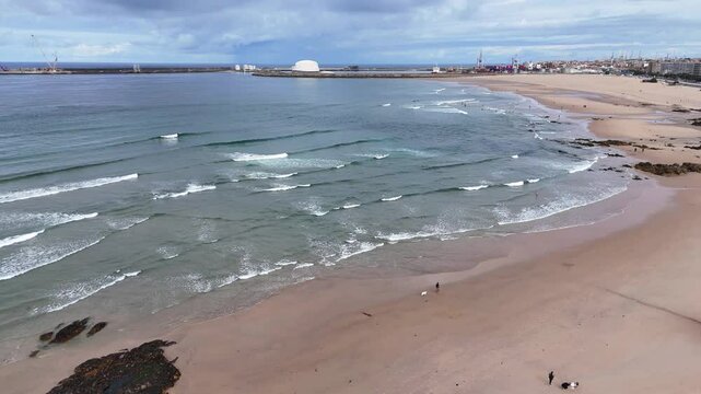 Portugal beach - an aerial shot of the sandy Matosinhos beach at the Atlantic Ocean.