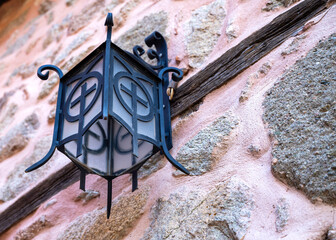 old street lamp against the wall