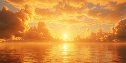 Sun setting into the sea. A stunning golden sunset over the ocean with fluffy clouds in the sky.