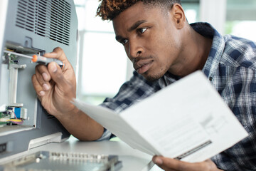 handyman fixing the office printer