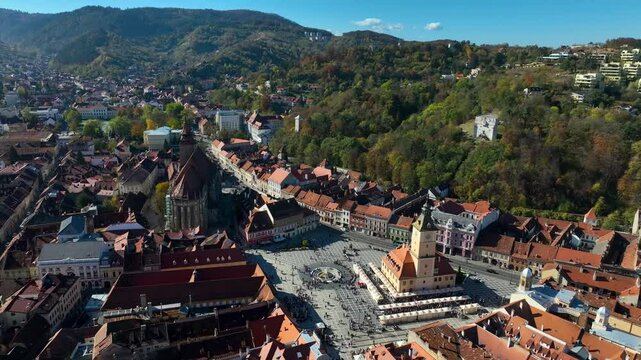 Drone Moving Right Over Black Church and Main Square Brasov Romania. Slow motion.
