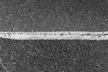 Fototapeta premium asphalt background of a white line