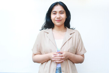 happy calm asian woman smiling confident wearing casual brown clothes isolated on white background