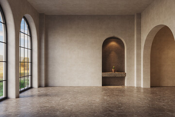 The room features arched walls and windows with neutral stucco walls, illuminated by warm yellow...