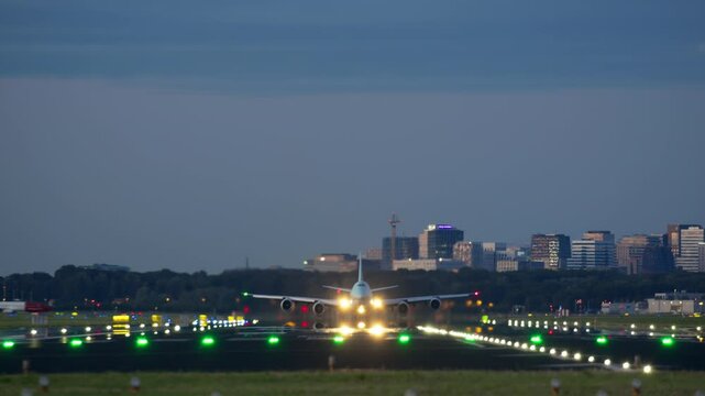 Amsterdam, Netherlands - August 28, 2024: Korean Air cargo Boeing 747 jet takes off at night from an illuminated runway. Korean Air operates a fleet of aircraft specializing in cargo and passenger