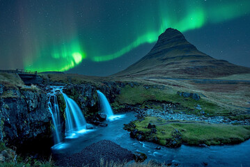 The beautiful green northern lights at Kirkjufell, Iceland.