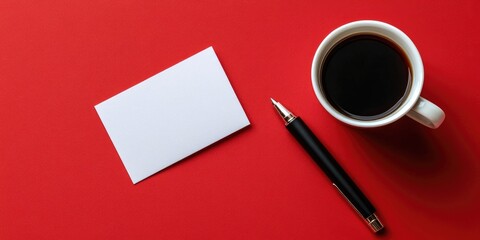 Image of blank business cards, a coffee cup, and a pen on a red paper background. Corporate identity template.