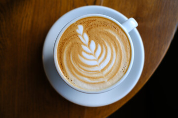 cup of coffee on wooden table