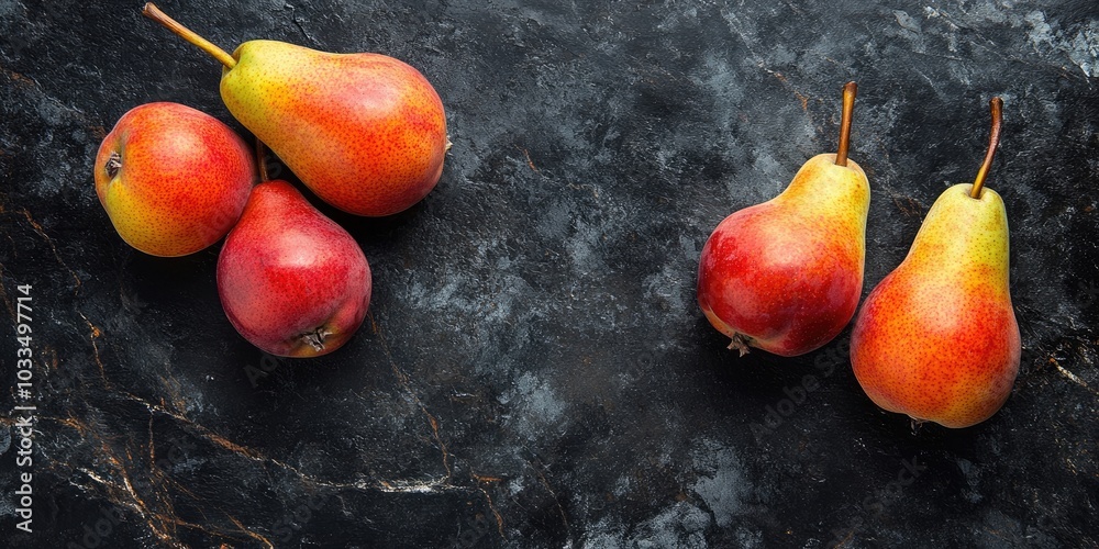 Poster fresh pears on a black stone surface. fruits. free space for text. top view.