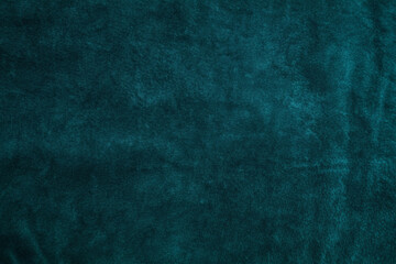 Emerald green velvet texture, close-up of smooth fabric with deep green tones and a luxurious appearance, featuring slight light reflection on the soft surface, highly detailed for textile backgrounds