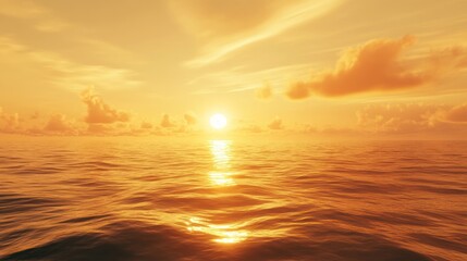 Obraz premium A vibrant sunset over the ocean with golden clouds reflecting in the water.