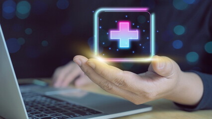 Businessman holding virtual blue plus sign for positive thinking mindset or healthcare insurance symbol concept for mental rejuvenation. positive thinking mindset