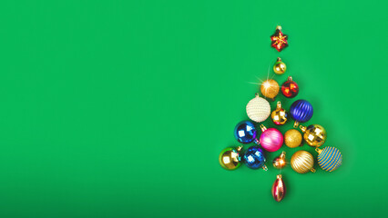 The Christmas tree is made of Christmas balls decoration. Minimum New Year concept. Card poster banner copy space green background