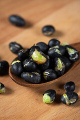 Black Soybean baked roasted fried shell cracked on table.