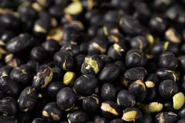 Black Soybean baked roasted fried shell cracked background.