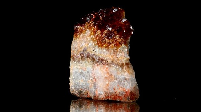 Citrine (yellow quartz) sample rotating against a black background