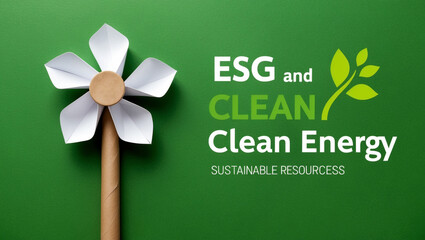 Eco friendly paper windmill on green background. Ecological concept