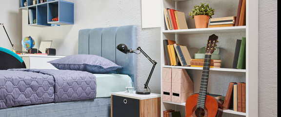Decorative white bookshelf in the bedroom style. © UnitedPhotoStudio