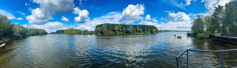Obraz premium background photo panoramic view, river and coast with recreation center and infrastructure for tourists, summer landscape