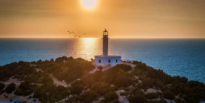 Panoramic aerial sunset view of the Cape Lefkatas Lighthouse on Lefkada island, Ionian Sea, Greece