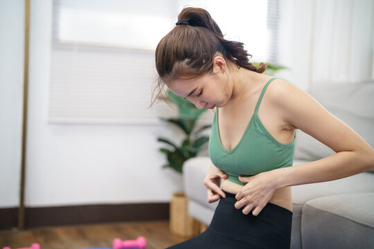 Asian woman with anorexia &nbsp;with measuring tape feeling unhappy. Anorexia problem body perception and dysmorphia concept