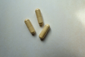 3 beige capsules of Saccharomyces boulardii probiotic dietary supplement from above