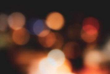 Christmas Background with street lights with defocus bokeh in Winter city,Abstract blurry colorful bokeh on black background with copy space for New Year or Xmas Banner 2025