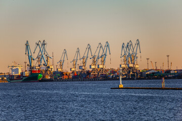 Sea port port cranes in terminals at Riga, Latvia main seaport. Industrial cranes for lifting...