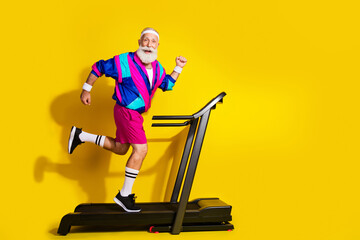 Full body photo banner of funny senior sportsman running treadmill dressed stylish retro sport...