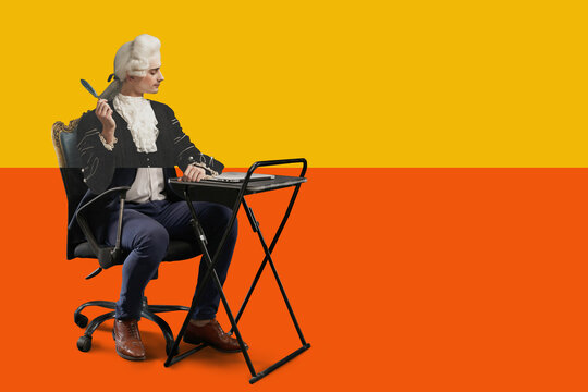 Historical figure, composer in 18th-century wig and suit sitting at modern desk, working on laptop, creating blend of past traditions with contemporary work culture. Concept of historical portrait