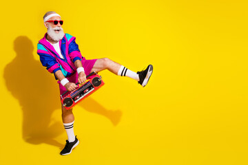 Full body photo banner of funny senior sportsman boom box dance dressed stylish retro sport costume isolated on yellow color background