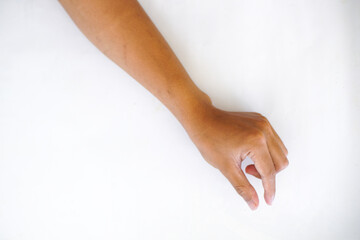 A hand making a pinching gesture, with the thumb and index finger close together, isolated on a plain white background. Ideal for concepts of holding, precision, or measurement.