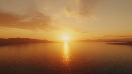 Fototapeta premium A breathtaking sunrise over a calm horizon, symbolizing a new day and fresh beginnings, with soft golden light casting warmth across the landscape