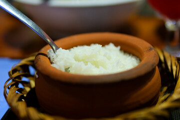 Hot white cooked rice steam bowl slow motion, Close up. Sticky rice after cooked. Asian Chinese Thai Japanese Indian traditional meal. Vegetarian boiled organic healthy nutrition