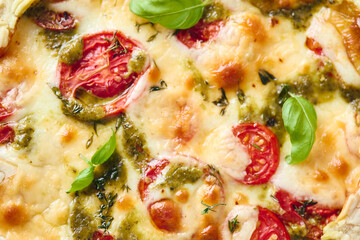 Puff pastry tart pizza with tomatoes, mozzarella cheese and pesto sauce. Galette Caprese