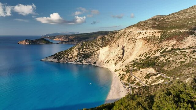 Myrtos Beach from above, featuring crystal clear waters and dramatic cliffs, highlighting nature of this famous Greek destination. Myrtos Beach - top summer destination in Greece, aerial shot