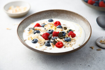 Granola with yogurt, fresh berries and coconut